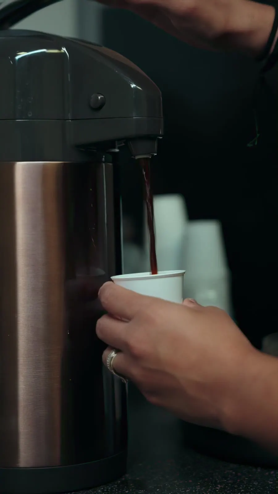 Coffee being poured into a cup at the shop