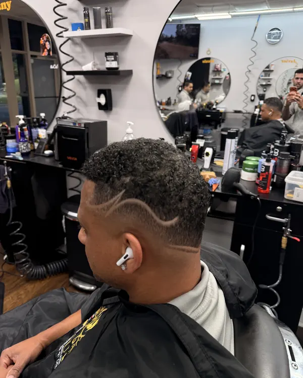 Skin fade with a freehand hair design