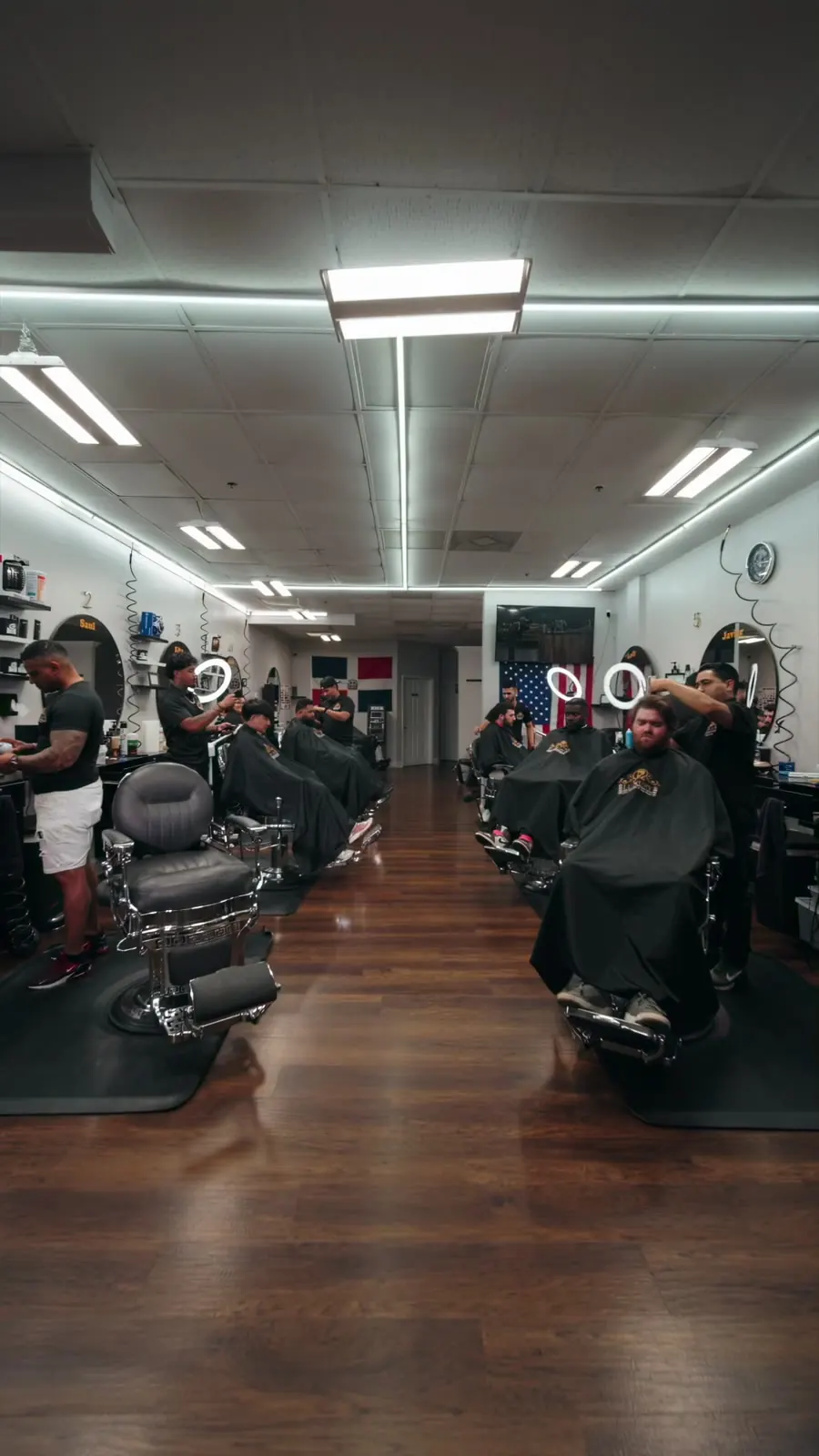 Row of barber chairs on the shop floor