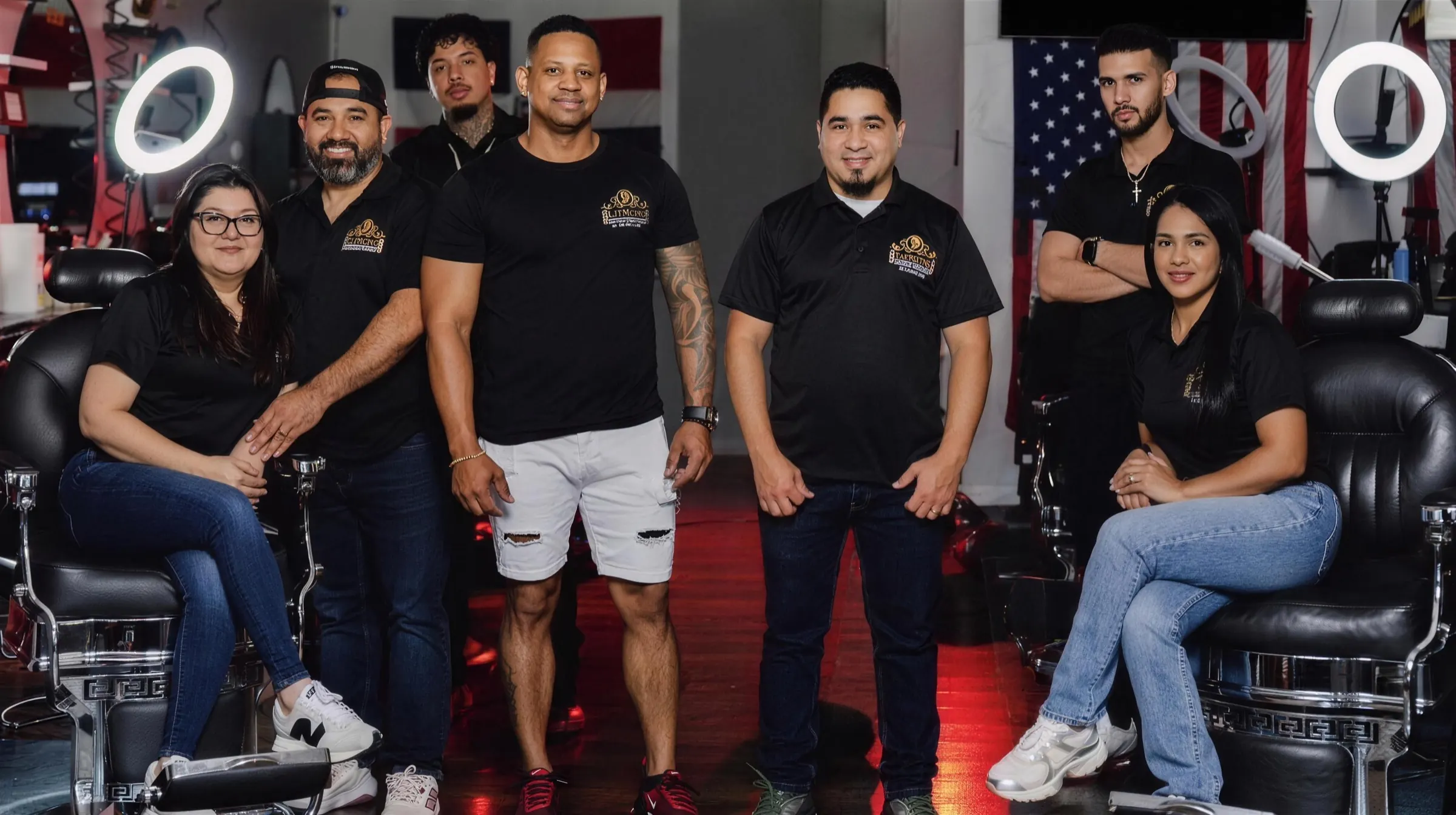 The Dominican Luxury Barbers team inside the shop in Cornelius, NC